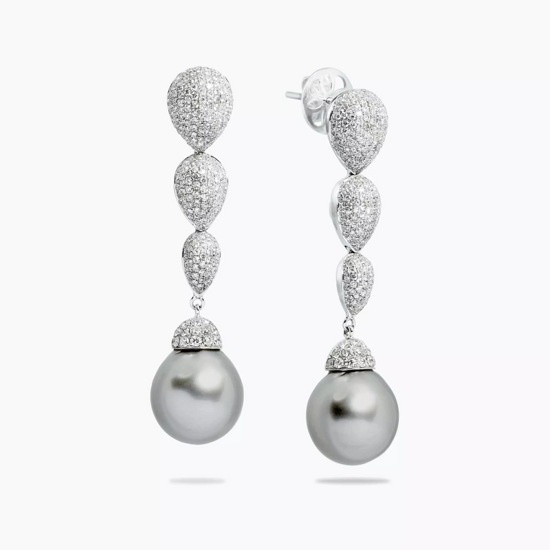A pair of 18ct white gold drop earrings featuring tahitian pearls and diamond accents.