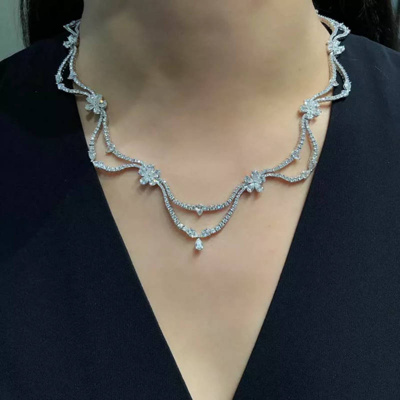 18ct white gold round brilliant and pear cut diamond necklet on the neck