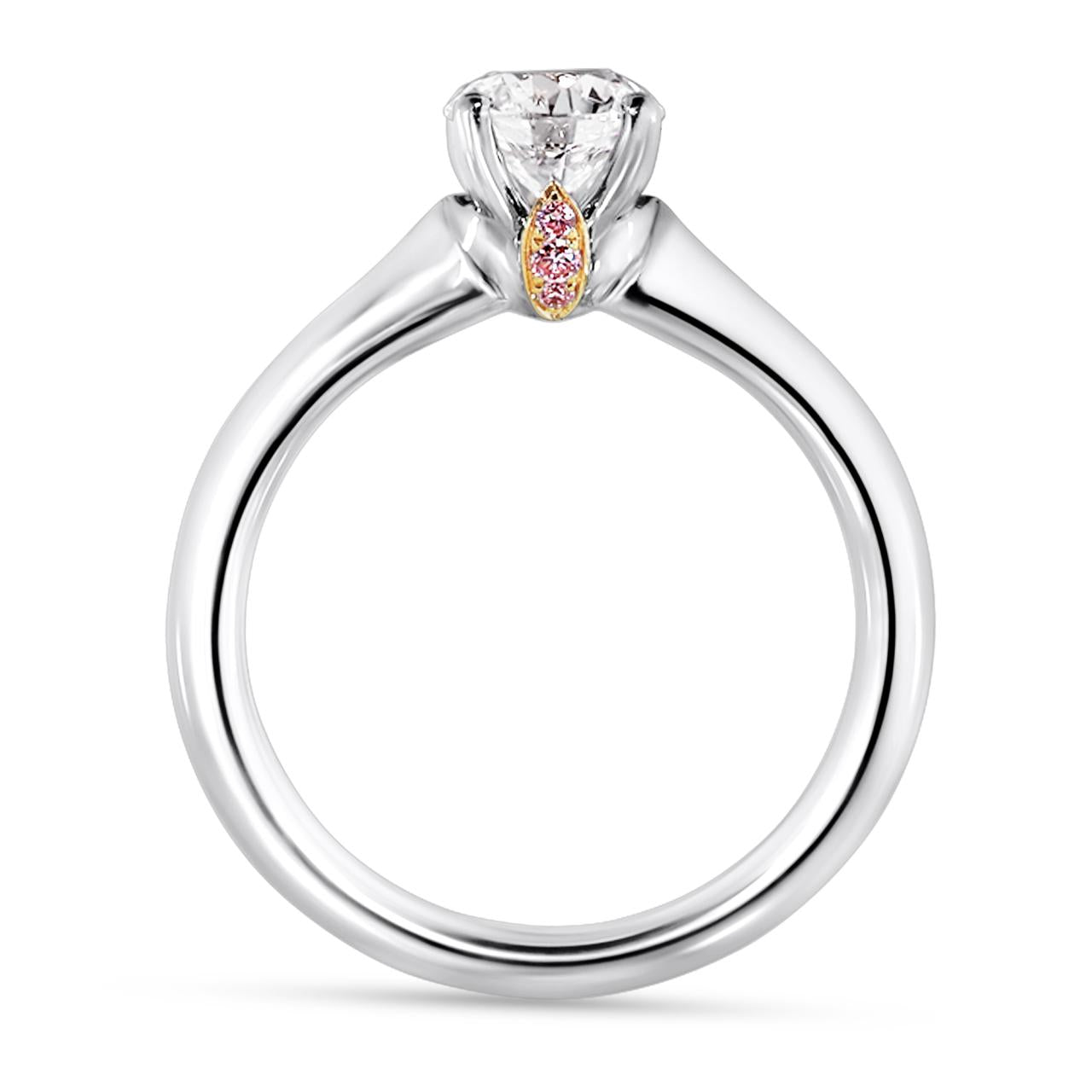 Platinum and rose gold round brilliant cut diamond engagement ring featuring pink round brilliant cut diamonds side profile