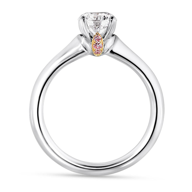 Platinum and rose gold round brilliant cut diamond engagement ring featuring pink round brilliant cut diamonds side profile