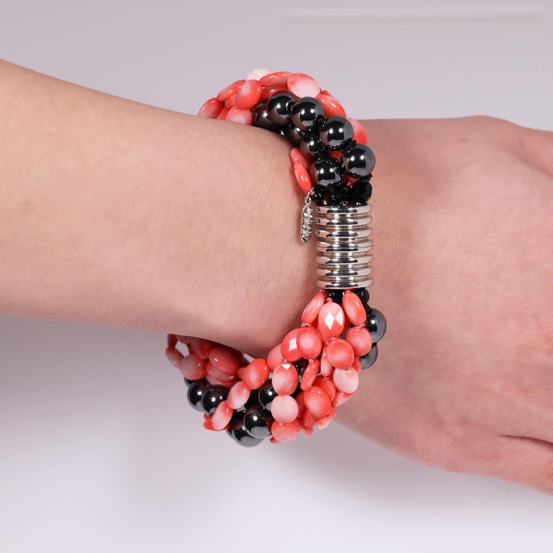 Coral and hemitite bracelet with a silver ribbed magnetic clasp from the Carmela Cerrone Collection on wrist