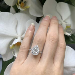 18ct white gold pear shaped diamond ring with halo