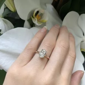 POSITANO - 18ct rose and white gold oval brilliant cut diamond solitaire ring