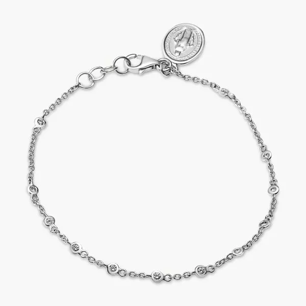 18ct white gold diamond bracelet with religious medal