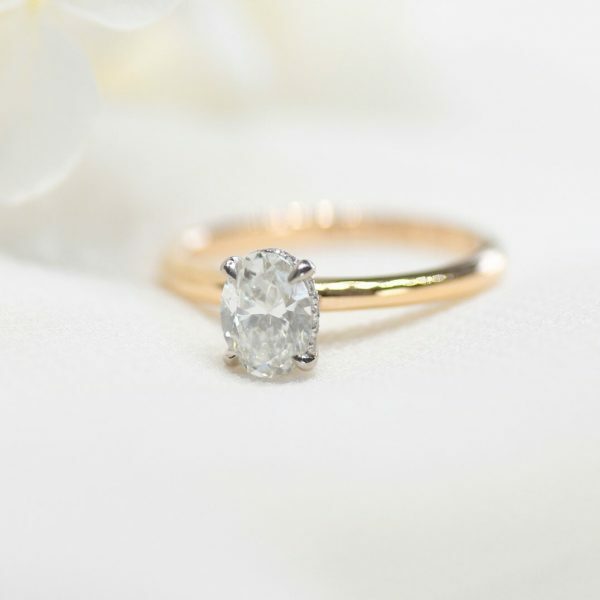 18ct rose and white gold 0.80ct F SI1 oval diamond ring