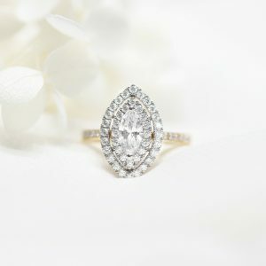18ct yellow and white gold marquise diamond ring with halo