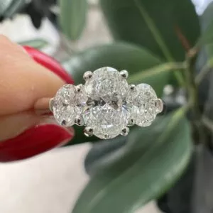 18ct white gold Oval cut three stone GIA diamond ring