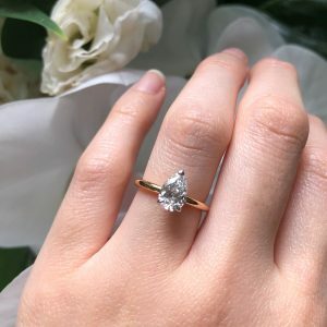 18ct rose and white gold pear shape solitaire diamond ring