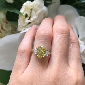 18ct yellow & white gold oval & heart three stone diamond ring