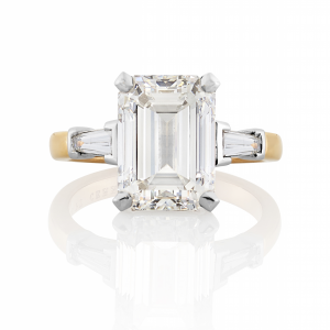 Platinum and rose gold emerald cut diamond ring