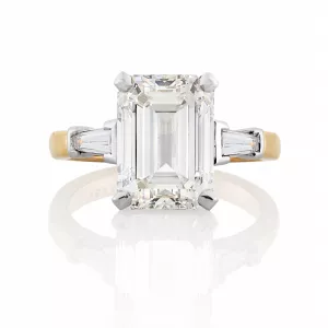 Platinum and rose gold emerald cut diamond ring