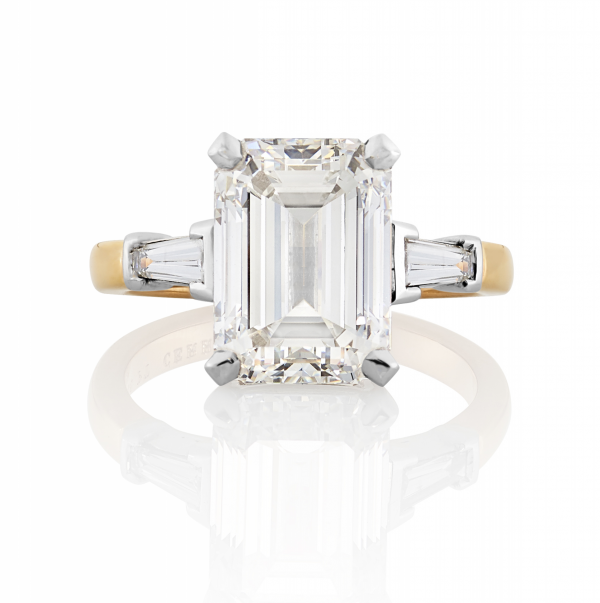 Platinum and rose gold emerald cut diamond ring