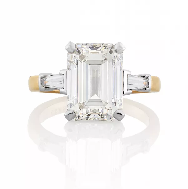 Platinum and rose gold emerald cut diamond ring