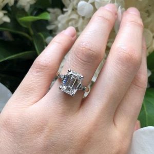 Platinum and rose gold emerald cut diamond ring