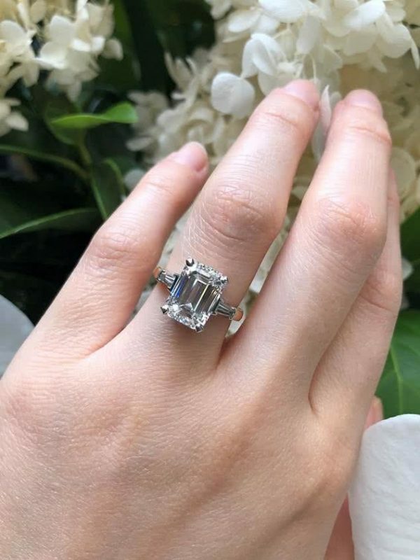 Platinum and rose gold emerald cut diamond ring