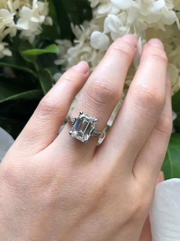 Platinum and rose gold emerald cut diamond ring