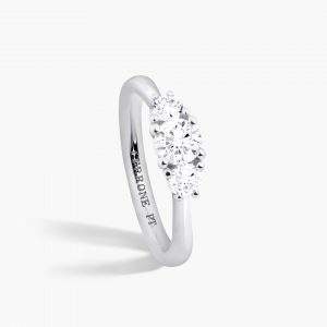 Platinum three stone round diamond ring