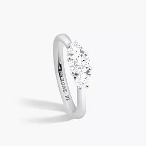 Platinum three stone round diamond ring