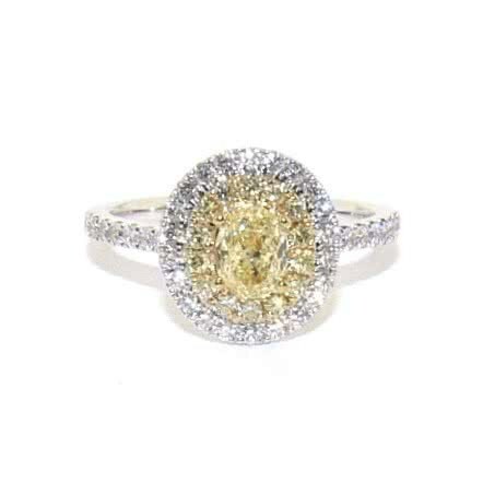 18ct white & yellow gold 0.59ct oval diamond ring