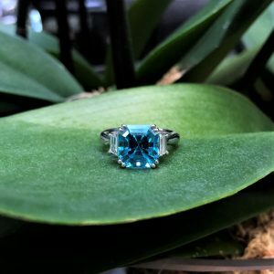 Platinum 7.38ct square emerald cut blue zircon and diamond ring