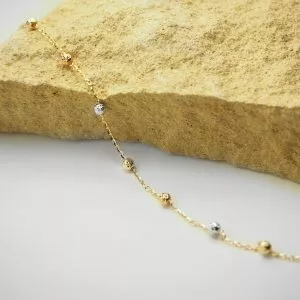 18ct yellow, white and rose gold bracelet with faceted balls