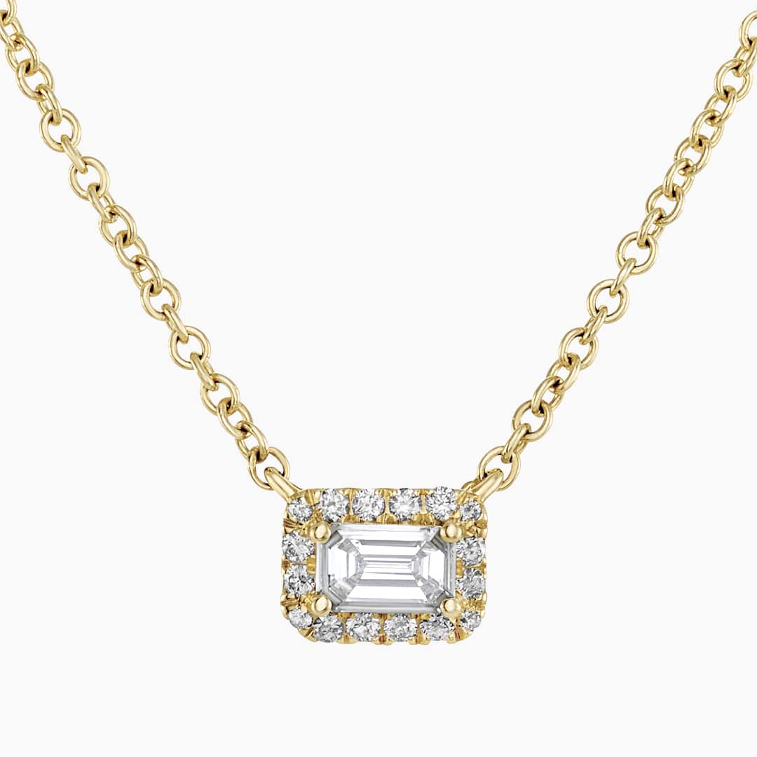 18ct gold 0.19ct emerald cut diamond halo necklace | Cerrone