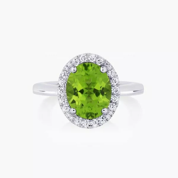 18ct white gold 2.82ct oval peridot and diamond halo ring
