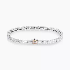 Platinum & rose gold emerald cut diamond tennis bracelet with pink diamonds