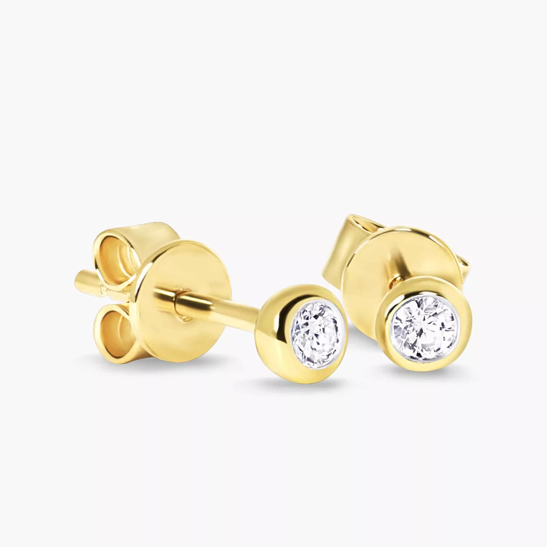 Bezel set diamond stud clearance earrings yellow gold