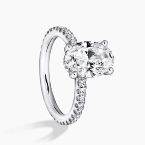 MILAN DIA BAND - 18ct white gold oval diamond hidden halo ring with diamond band