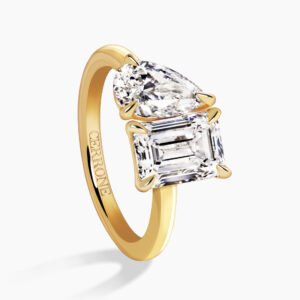18ct yellow gold emerald cut and pear shaped diamond ring