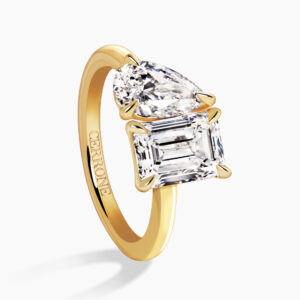18ct yellow gold emerald cut and pear shaped diamond ring