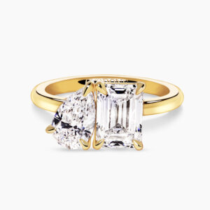 18ct yellow gold emerald cut and pear shaped diamond ring