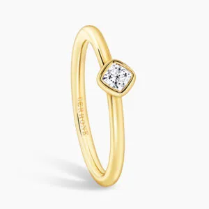 18ct yellow gold 0.19ct FG VS cushion cut diamond solitaire bezel ring